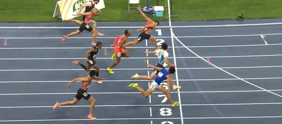 当时他与美国选手特拉梅尔同时冲过终点,虽然特拉梅尔的手脚先过线,但