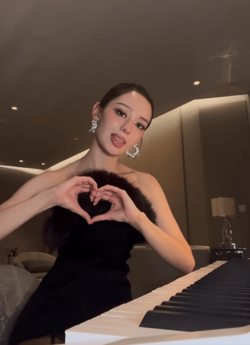 吉娜穿紧身裙勾勒曼妙身姿 戴墨镜气质优雅摩登