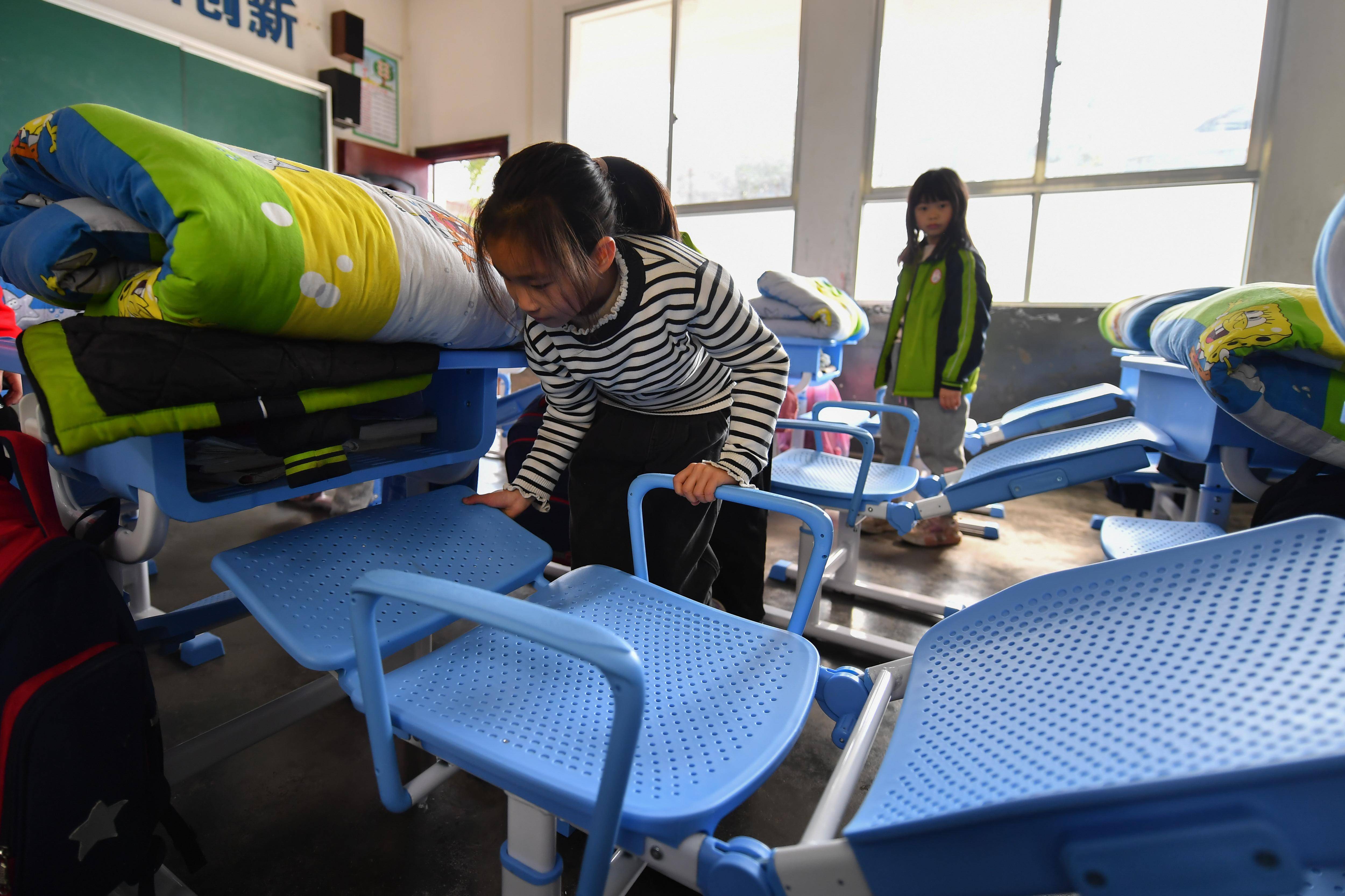 新华社记者 陈泽国 摄1月10日,在浏阳市龙伏镇黄桥完全小学,三年级