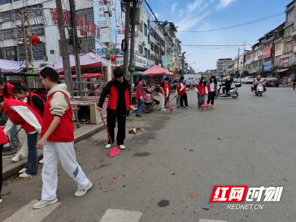 江永桃川:一抹志愿红 焕发新春新貌_街道_垃圾袋_进行